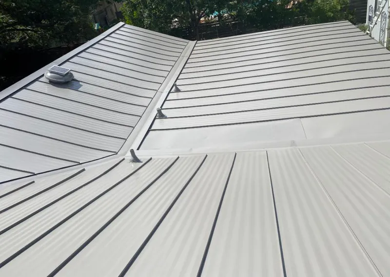 Solar attic fan installed on a metal roof for Roof Ventilation in Dayton